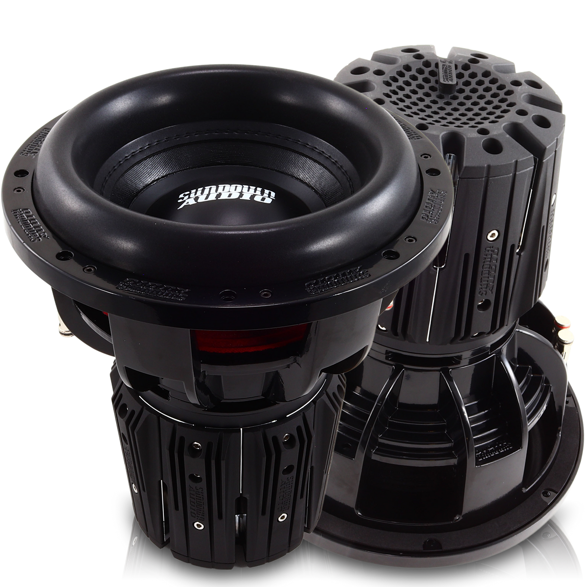 Two large black Nightshade NS-Series NS6 12 3000W Subwoofers from Sundown Audio boast a sleek cylindrical design with ridged sides. The neodymium subs deliver impressive power, adorned with the brand logo on the glossy top, while advanced thermal management ensures optimal performance.