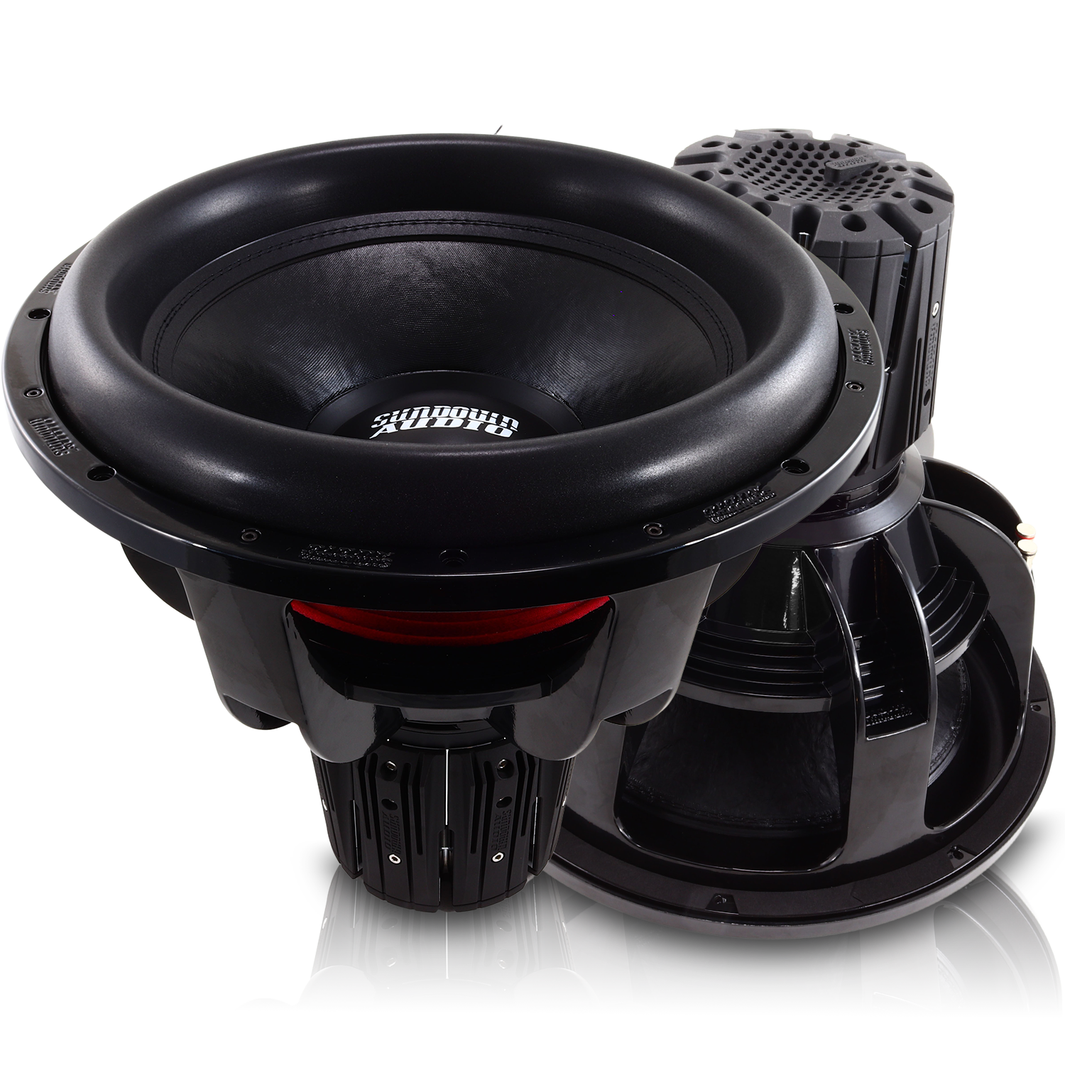 Close-up of two large Nightshade NS-Series NS6 18 3000W Subwoofers by Sundown Audio, placed on a reflective surface. The neodymium subs feature prominent cones and detailed frames, with the brand logo visible in the center against a white background.