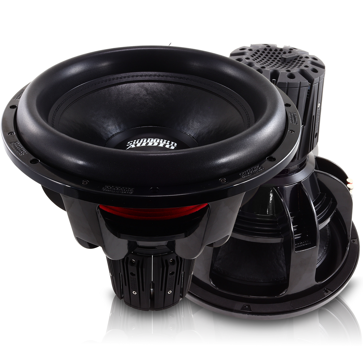 Close-up of two large Nightshade NS-Series NS6 18 3000W Subwoofers by Sundown Audio, placed on a reflective surface. The neodymium subs feature prominent cones and detailed frames, with the brand logo visible in the center against a white background.