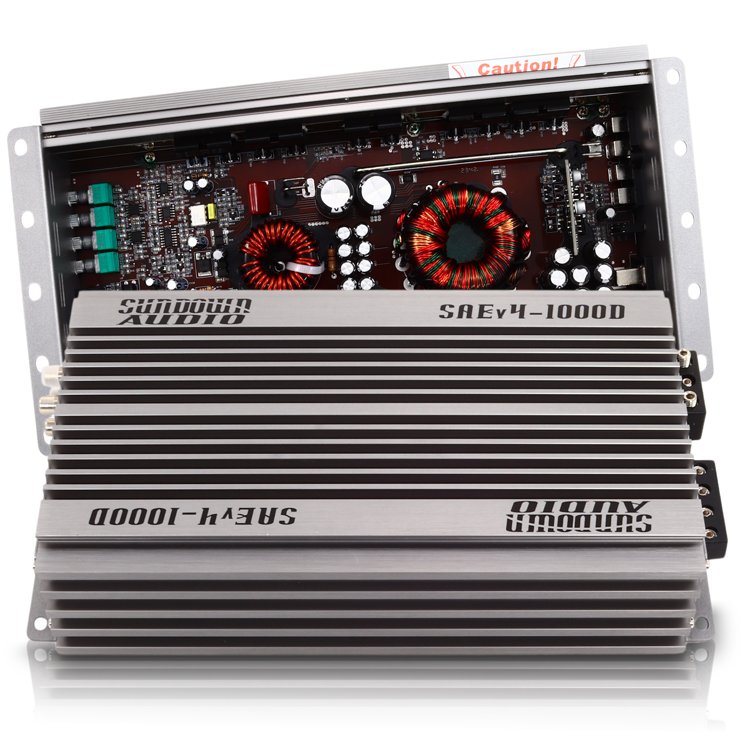 The Sundown Audio SAEv4-1000.1D Mono Amplifier, shown partially opened, displays internal components such as capacitors and coils against its silver casing, highlighting the intricate detailing and robust design of its electronic parts.