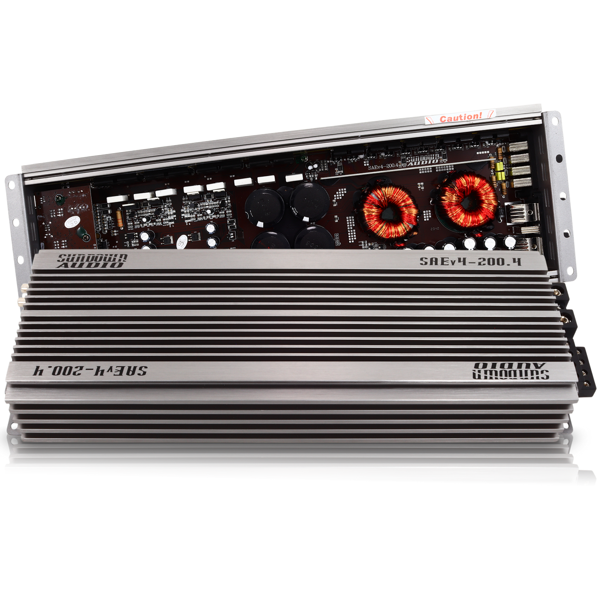 The Sundown Audio SAEv4-200.4 4-Channel Amplifier features a silver finish with exposed circuitry, including visible capacitors and coils. Its body has horizontal ridges with the Sundown Audio logo engraved, and the top panel is slightly open to showcase its internal electronics.