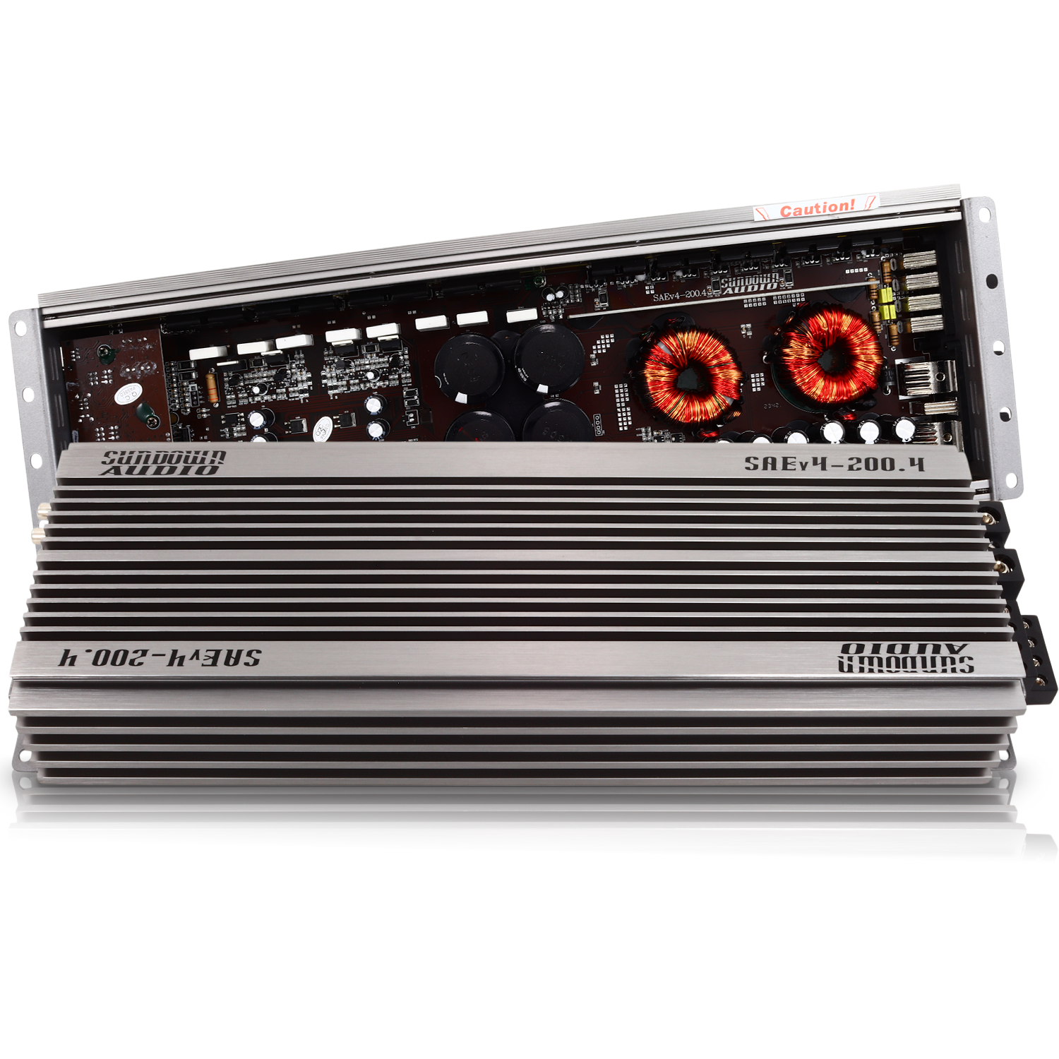 The Sundown Audio SAEv4-200.4 4-Channel Amplifier features a silver finish with exposed circuitry, including visible capacitors and coils. Its body has horizontal ridges with the Sundown Audio logo engraved, and the top panel is slightly open to showcase its internal electronics.