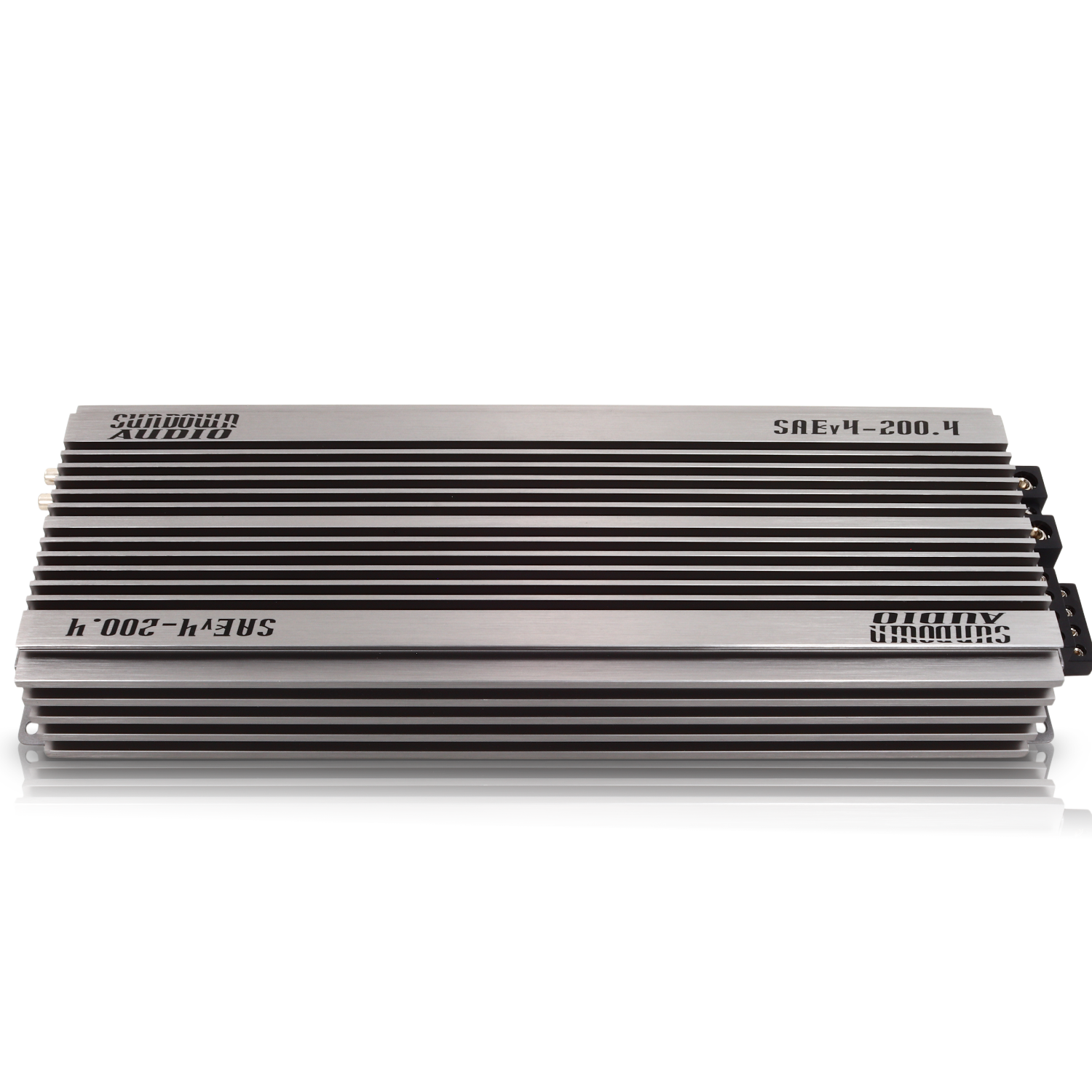 The silver SAEv4-200.4 4-channel amplifier by Sundown Audio has a sleek metallic finish and compact design, with black horizontal fins. Its high-fidelity Class A/B design is perfect for enhancing in-vehicle audio systems, offering superior sound quality.