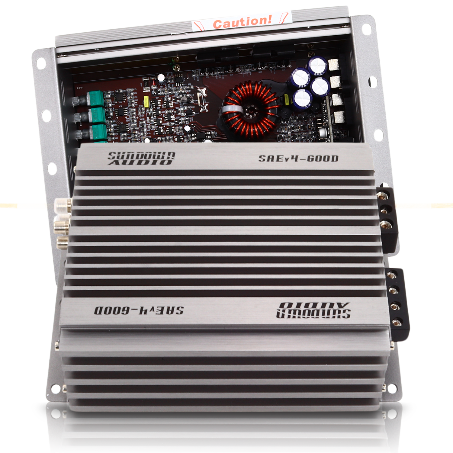 A gray Sundown Audio SAEv4-600.1D Mono Amplifier, partially opened to display internal components like a circuit board and capacitors, has a ribbed exterior with clear branding characteristic of this Class D amplifier.