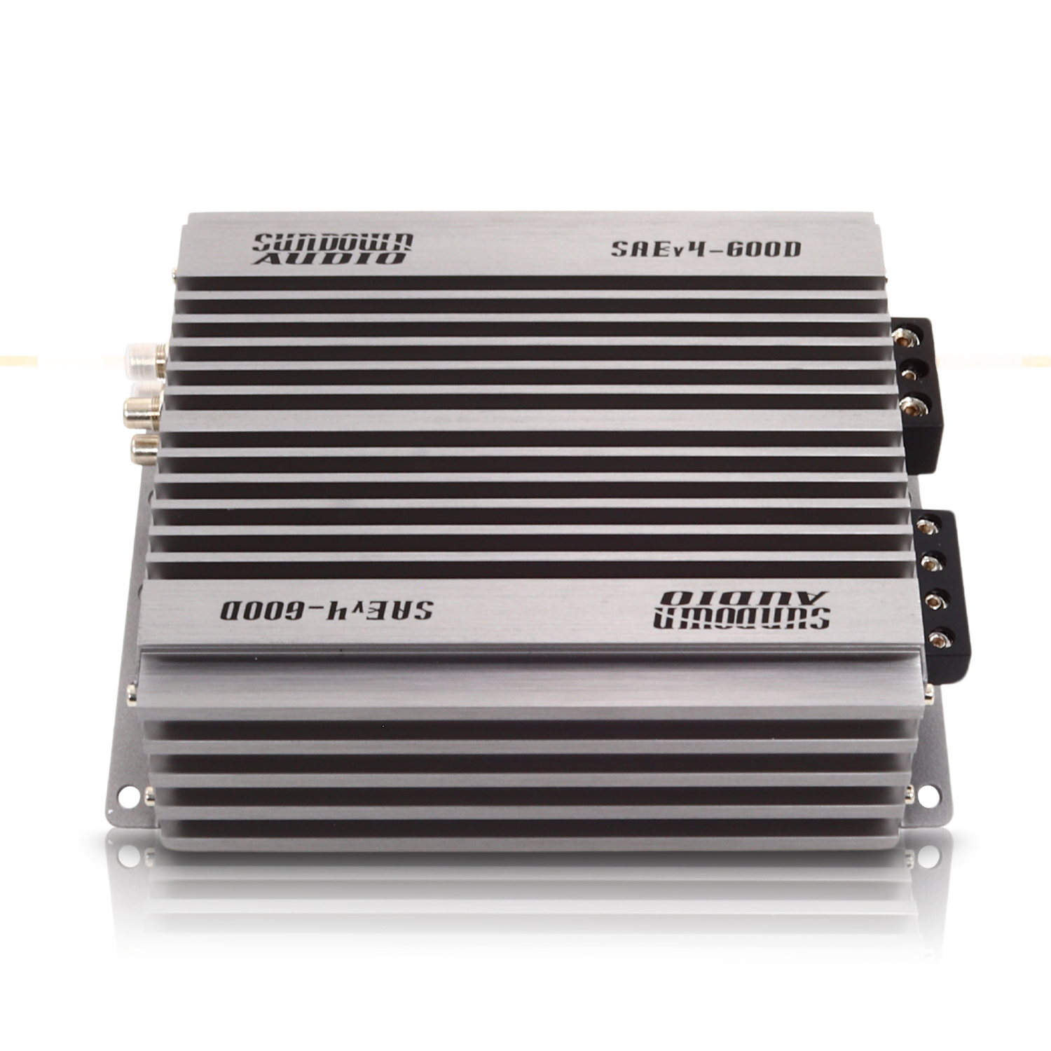 The Sundown Audio SAEv4-600.1D Mono Amplifier features a ribbed silver casing with sleek black accents and engraved branding. This powerful car audio amplifier offers multiple side connection ports for versatile connectivity.