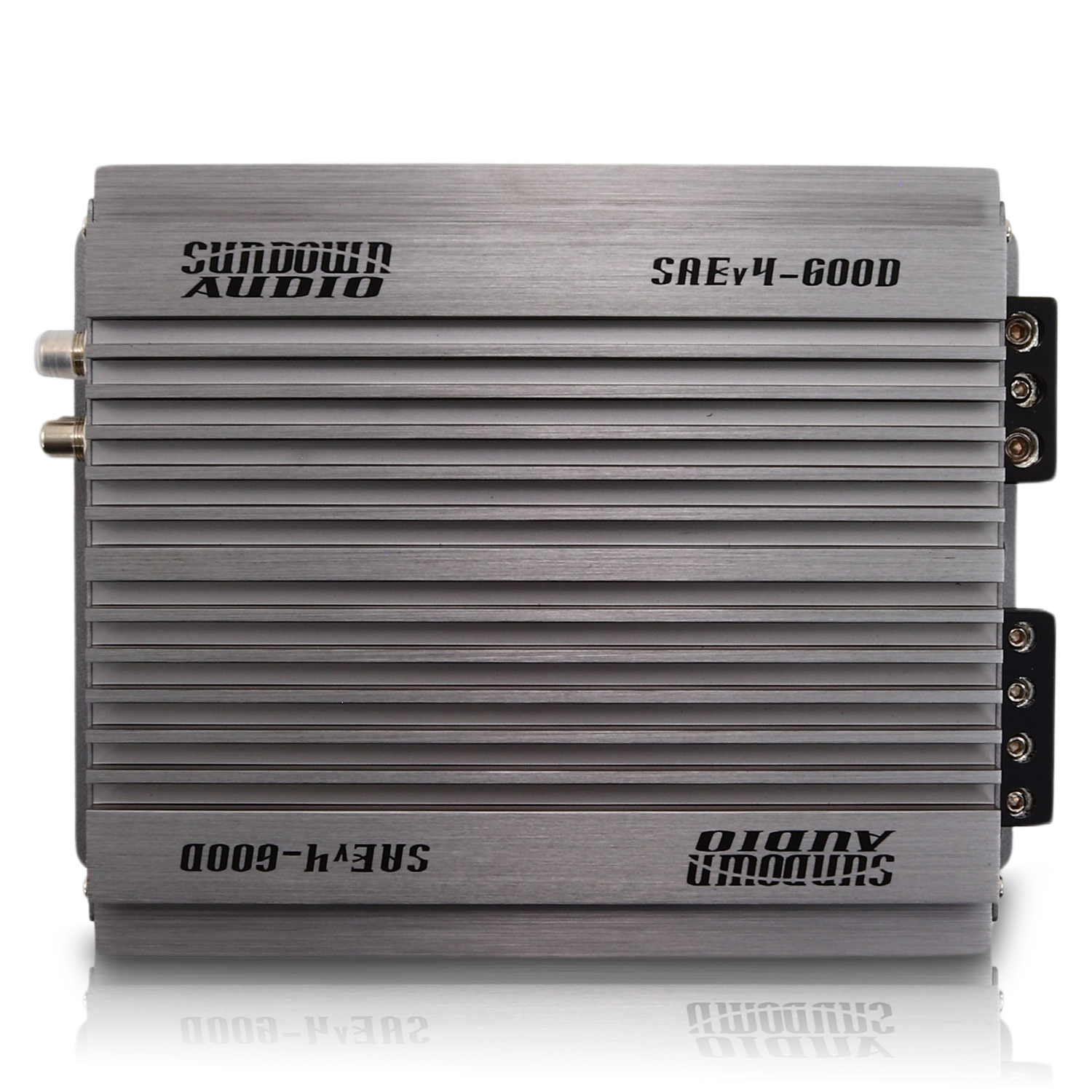 The sleek silver SAEv4-600.1D Mono Amplifier by Sundown Audio is a Class D car audio amp with a unique ridged design. Bold branding adorns its top and side, while multiple right-side connection ports provide versatile audio connectivity.
