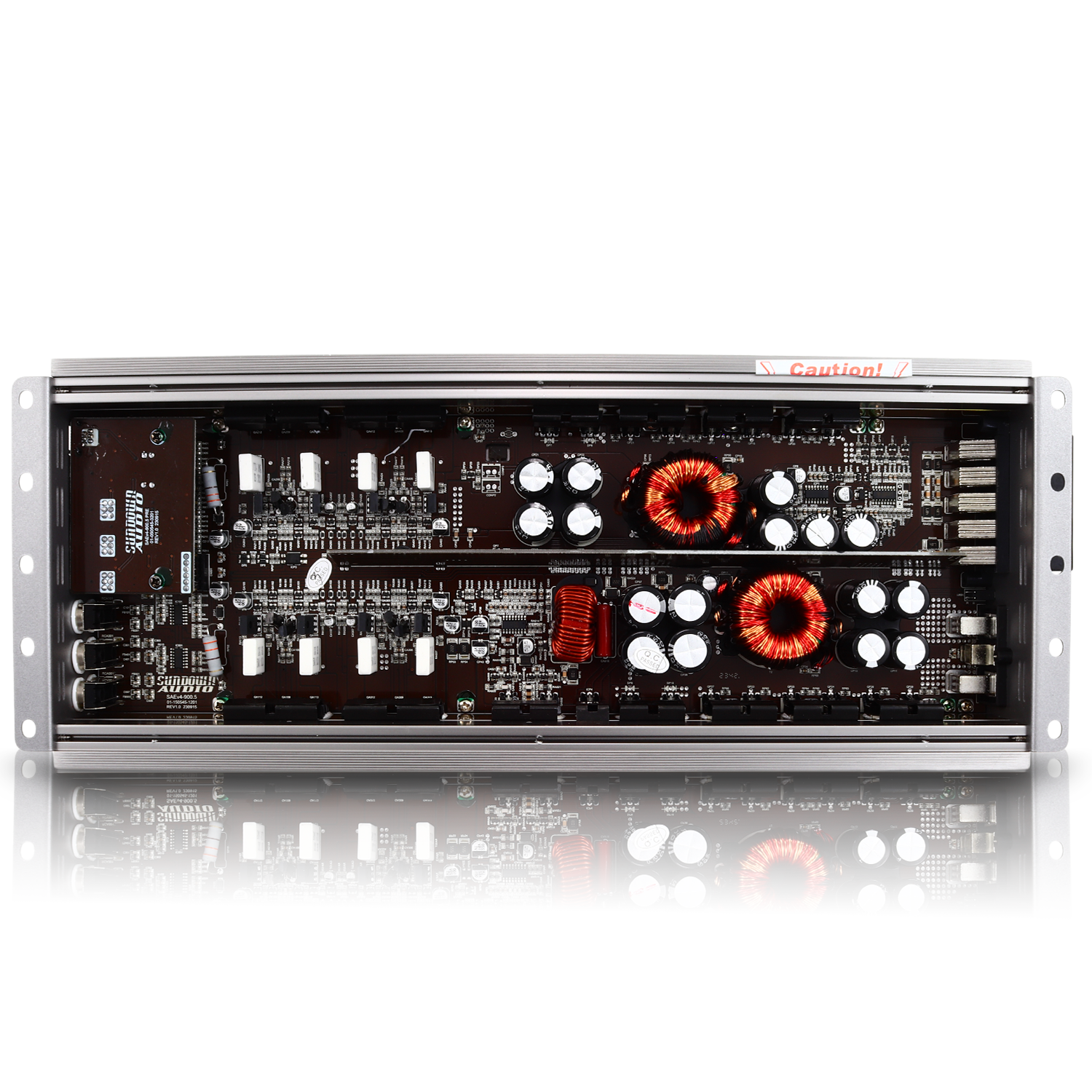 Interior view of a Sundown Audio SAEv4-900.5 5-Channel Amplifier with Class A/B+D design, showing circuit boards with capacitors, transistors, and red inductors among various small components on a rectangular layout.