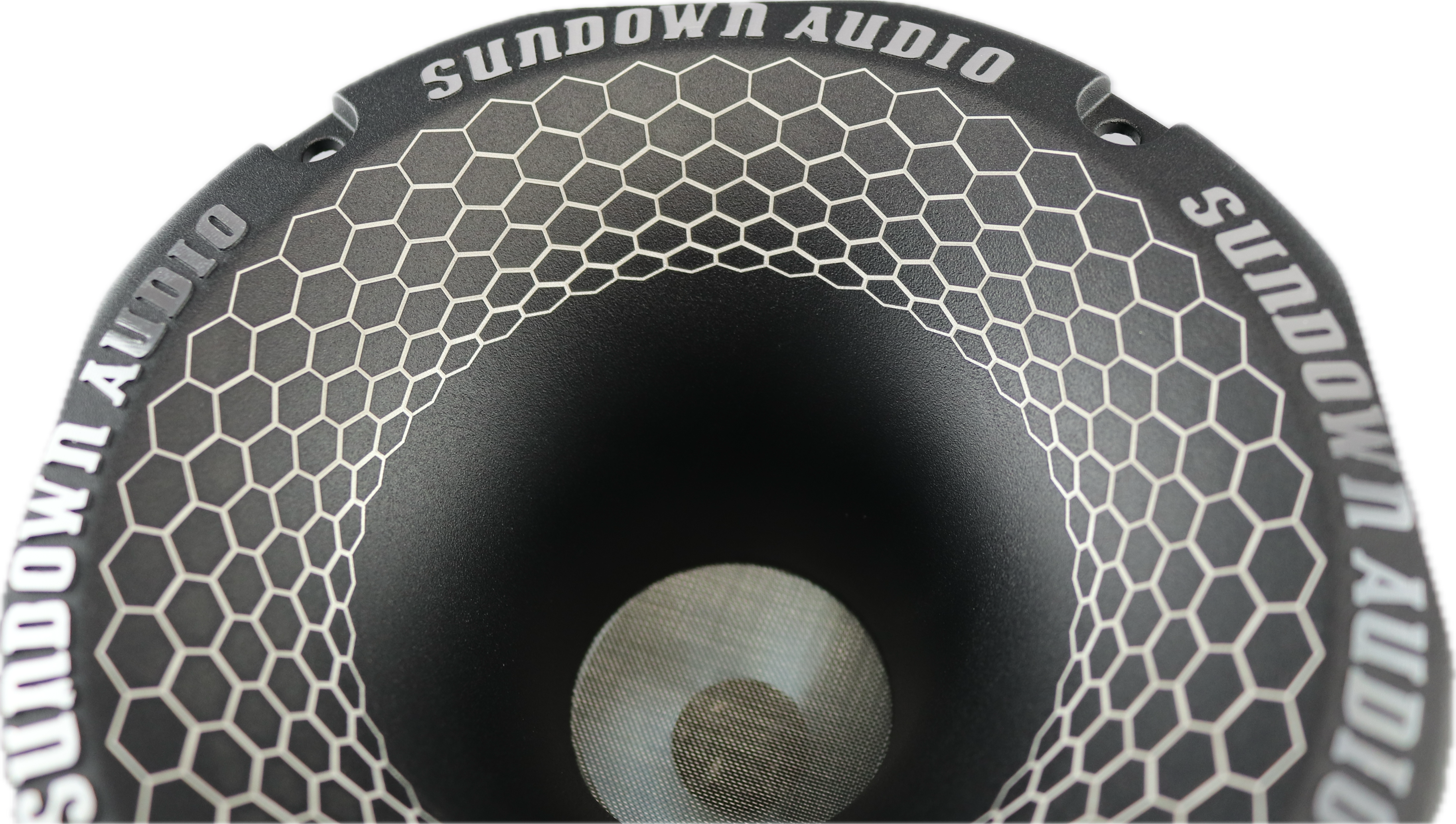 Close-up of a black SHFST 2 Throat Super Horn by Sundown Audio featuring hexagonal patterns. The titanium diaphragm adds a dynamic, modern look and delivers an exceptional wide frequency range audio experience.
