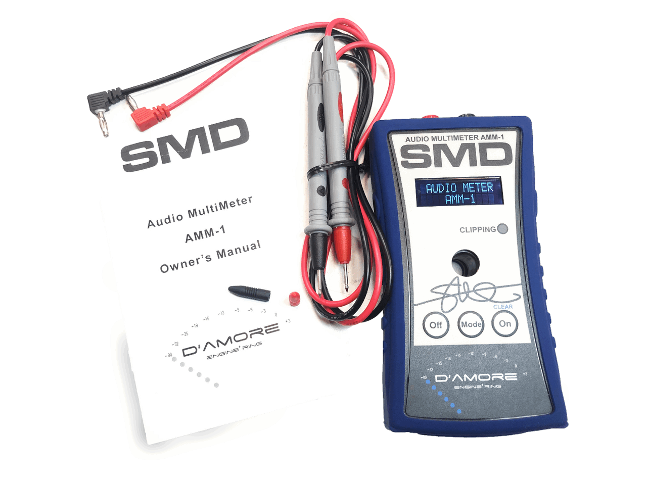 The image showcases an SMD Audio Multimeter AMM-1 by Steve Meade Designs, equipped with red and black probes, making it perfect for impedance measurement. It includes several buttons and a digital display, along with a user manual featuring logos and illustrations related to the multimeter.