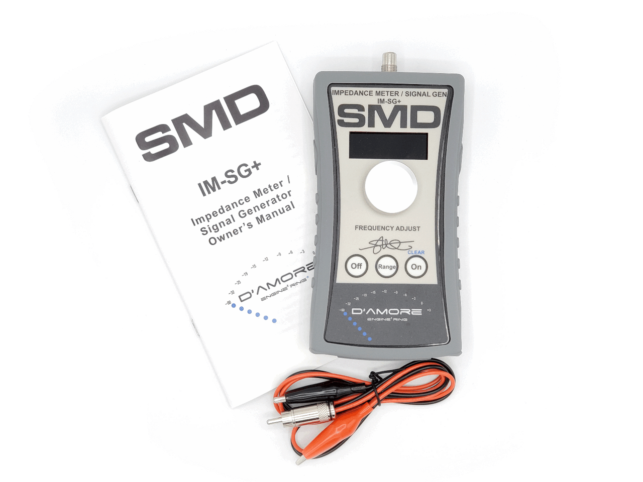 The SMD IM-SG+ (Impedance Meter - Signal Generator PLUS) by Steve Meade Designs is showcased with its owner's manual and two clip leads. Perfect for testing speaker crossovers, the device includes control buttons and a frequency adjust knob on the front panel.