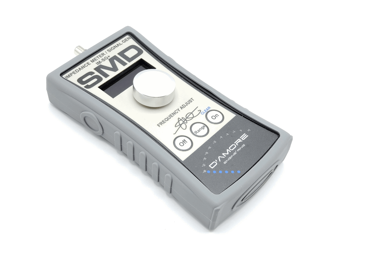 The silver and gray SMD IM-SG+ from Steve Meade Designs functions as both an impedance meter and signal generator. It includes a frequency adjust knob, three control buttons, and features the logos of D’Amore Engineering alongside Steve Meade Designs—perfect for fine-tuning speaker crossovers.