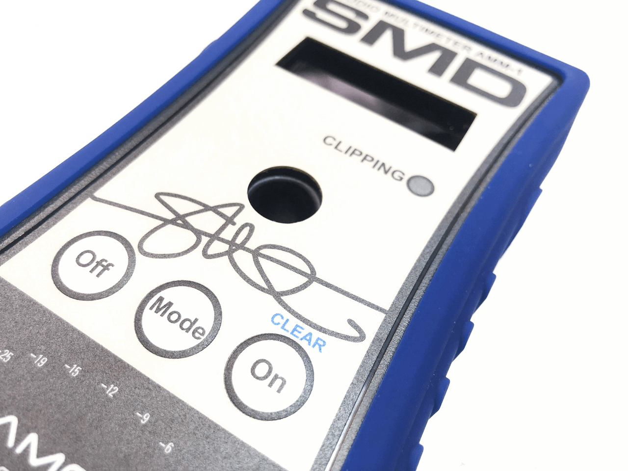 A close-up of the SMD Audio Multimeter AMM-1 by Steve Meade Designs, showcasing buttons labeled Off, Mode, and On. The device features a screen displaying "CLIPPING" above it for precise subwoofer tuning. Encased in durable blue protective housing, this tool guarantees superior audio quality.