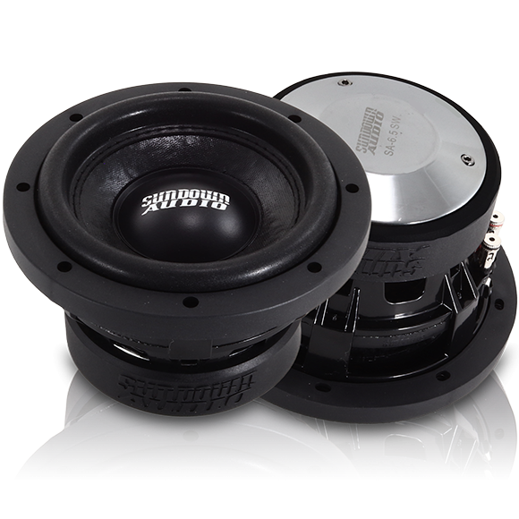 Close-up of several Sundown Audio SA-Series v.2 6.5 black subwoofers, with branding on the speaker cone promising deep bass. The shiny metal backplate on one high-performance subwoofer displays specifications, showcasing a robust, industrial design.