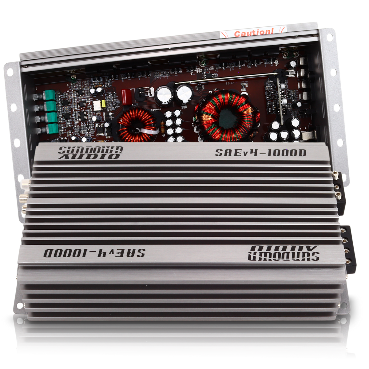 The Sundown Audio SAEv4-1000.1D Mono Amplifier, shown partially opened, displays internal components such as capacitors and coils against its silver casing, highlighting the intricate detailing and robust design of its electronic parts.