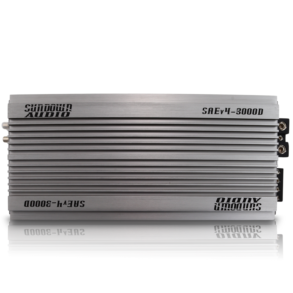 The silver SAEv4-3000.1D Amplifier by Sundown Audio showcases a sleek, horizontal finned design with top branding. This Class D amplifier includes advanced protective circuitry, ideal for enhancing any high-quality car audio system.