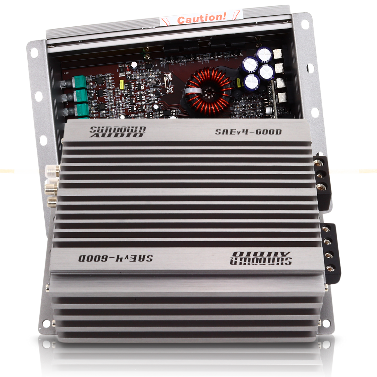 A gray Sundown Audio SAEv4-600.1D Mono Amplifier, partially opened to display internal components like a circuit board and capacitors, has a ribbed exterior with clear branding characteristic of this Class D amplifier.