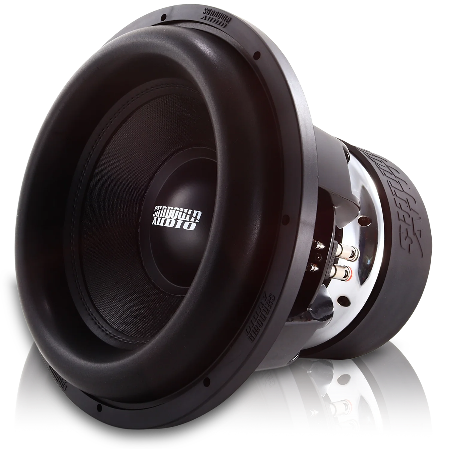 A large black Sundown Audio SDDN 15" Limited Edition Competition Subwoofer D1 is displayed at an angle, highlighting its impressive 3,500 watts RMS cone and surrounding frame. The neodymium cap adds a modern flair while the reflective surface beneath enhances the image's depth.