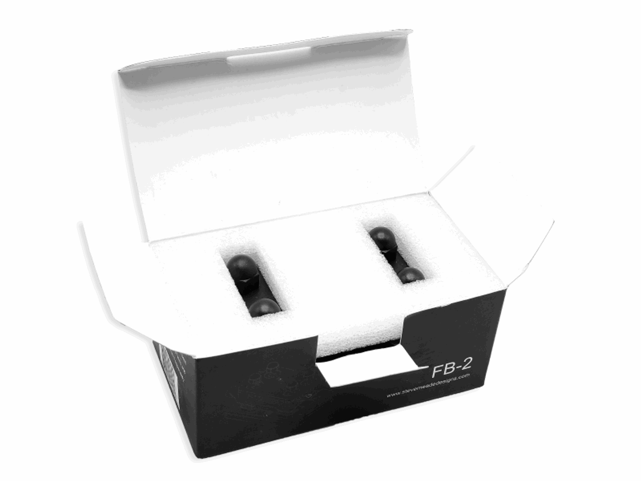 An open box labeled "SMD FB-2 Double Fuse Block - Steve Meade Designs" in black, containing two bottles secured in white foam packaging, is ideal for aftermarket sound systems.