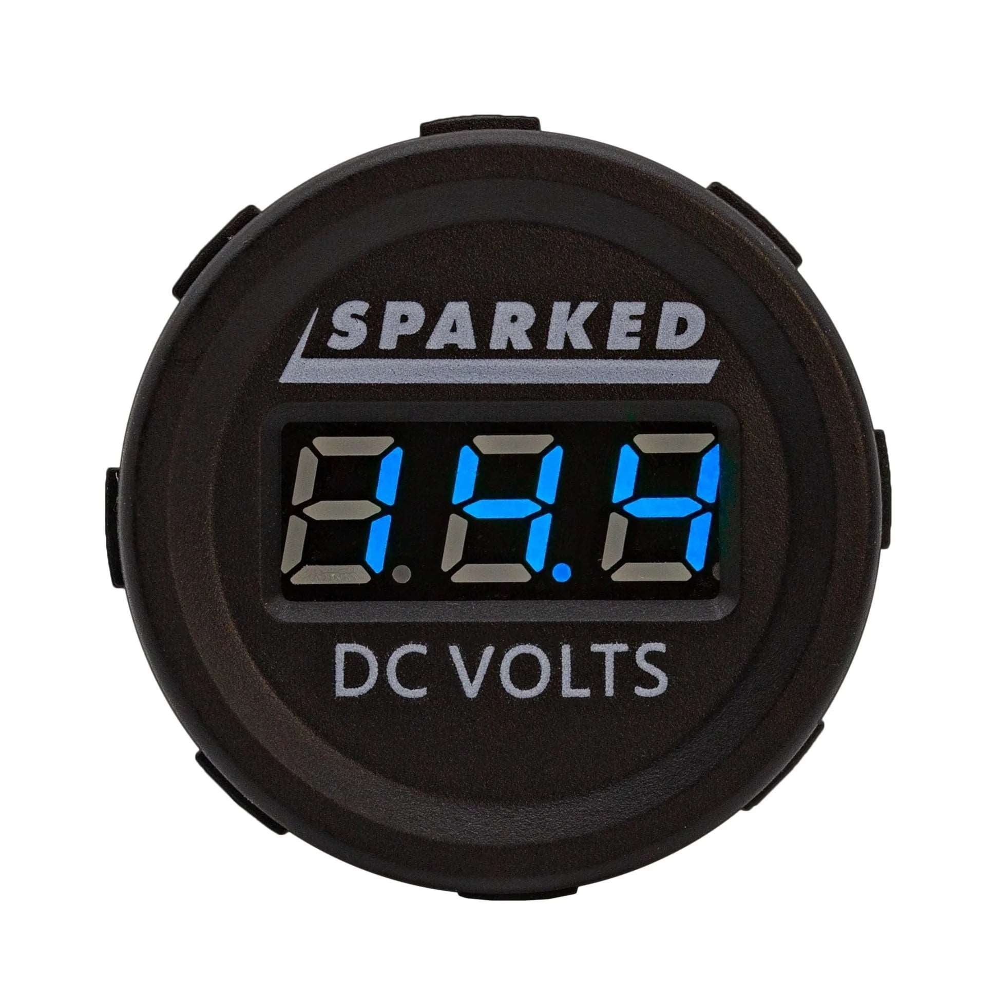 The Single 12VDC Voltmeter Battery Voltage Monitor by Sparked Innovations boasts an IP67 waterproof design and a sleek black display with blue LED numbers showing 13.1 volts. The brand name is prominently displayed above, while "DC Volts" is located below, guaranteeing durability and precision in any setting.