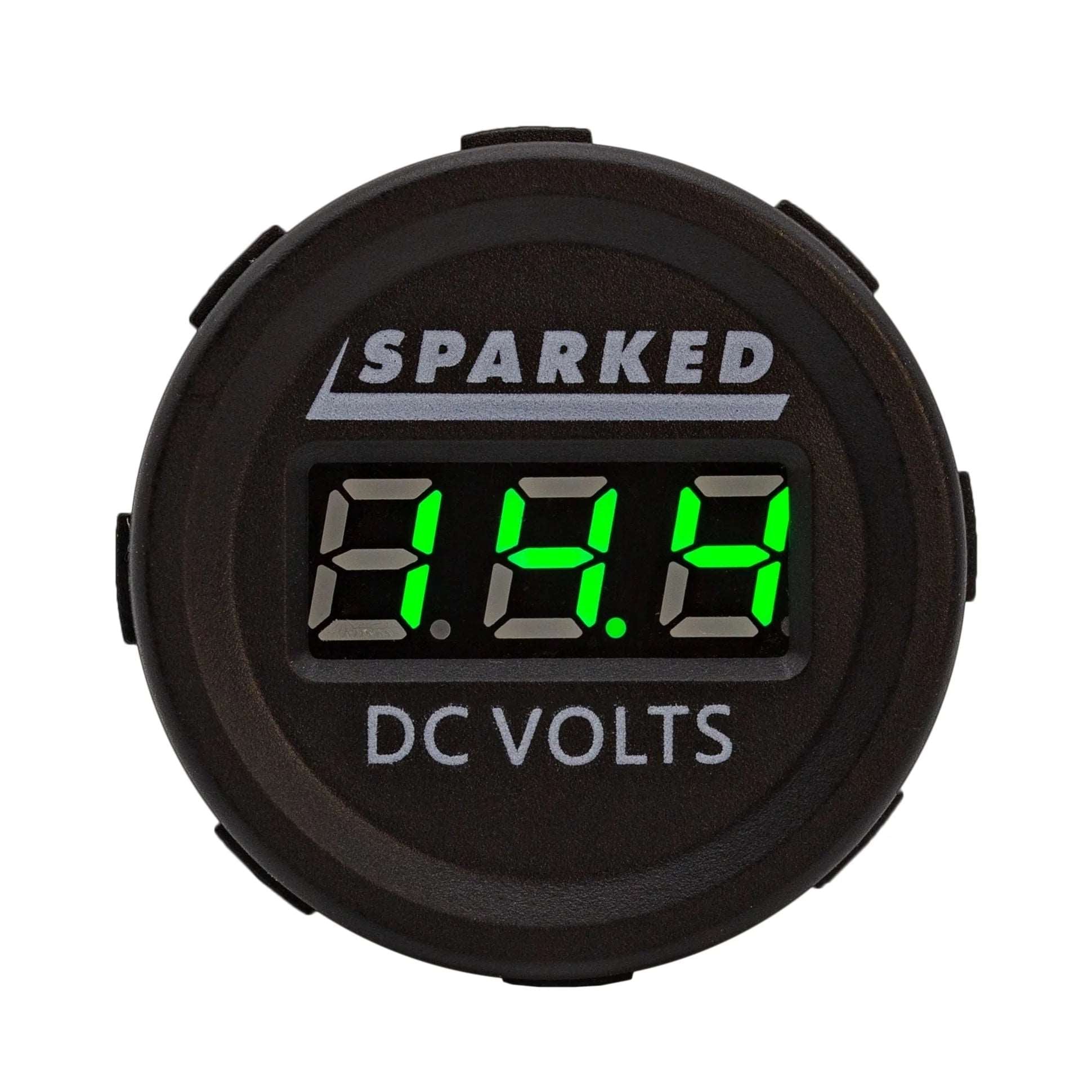 The Single 12VDC Voltmeter Battery Voltage Monitor, by Sparked Innovations, is a round device featuring an LED display that shows a reading of 12.8 in green numbers. The sleek black face is adorned with the words "SPARKED" and "DC VOLTS." This IP67 waterproof device guarantees reliable performance in any condition.