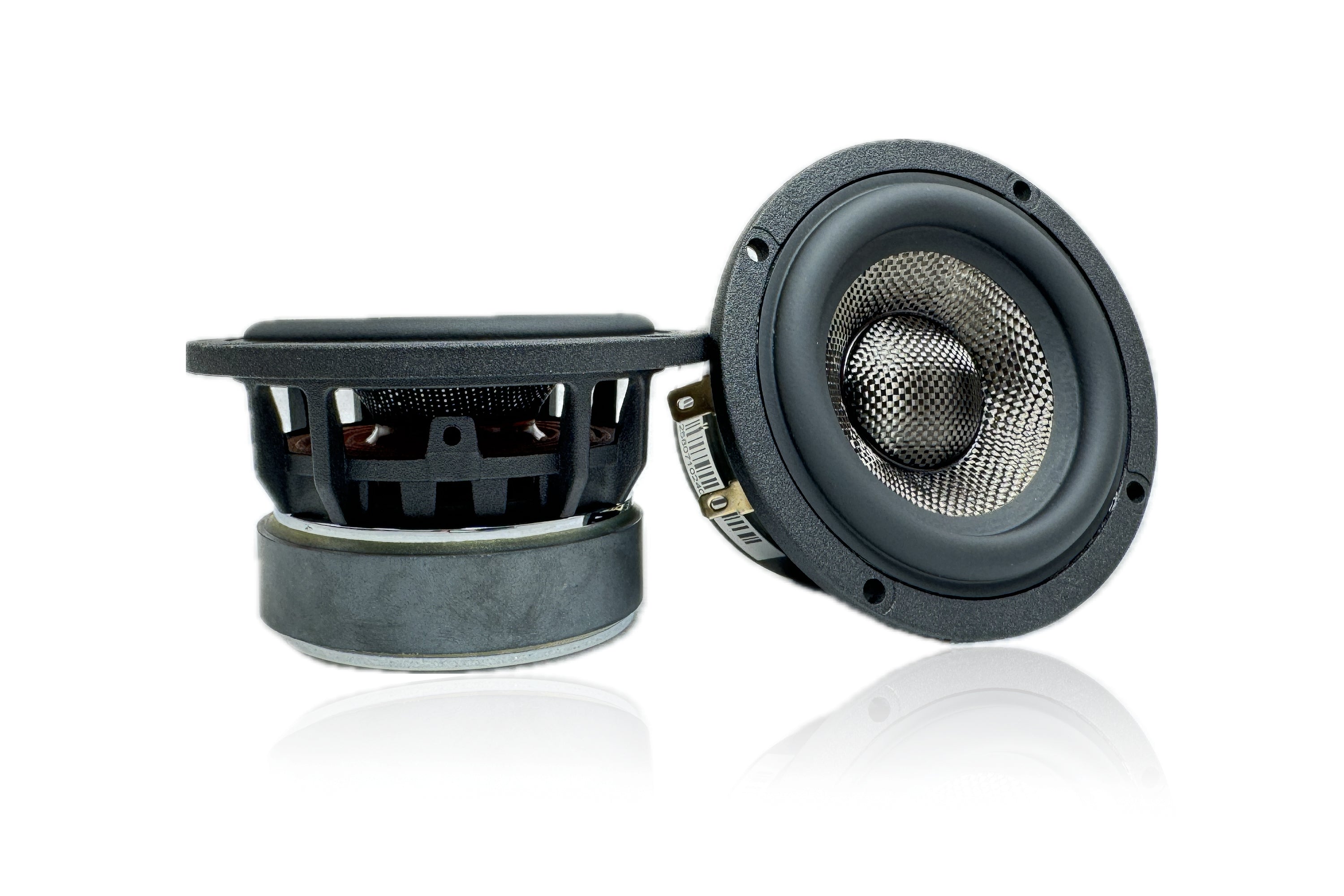 Two Sundown Audio SA-Series SA-3M 3" speakers are showcased against a white background. The left speaker stands upright, while the right one tilts back slightly, revealing its cone and magnet structure. Each features a durable metal grille design, promising robust protection and enhanced low-end extension for full-range audio excellence.