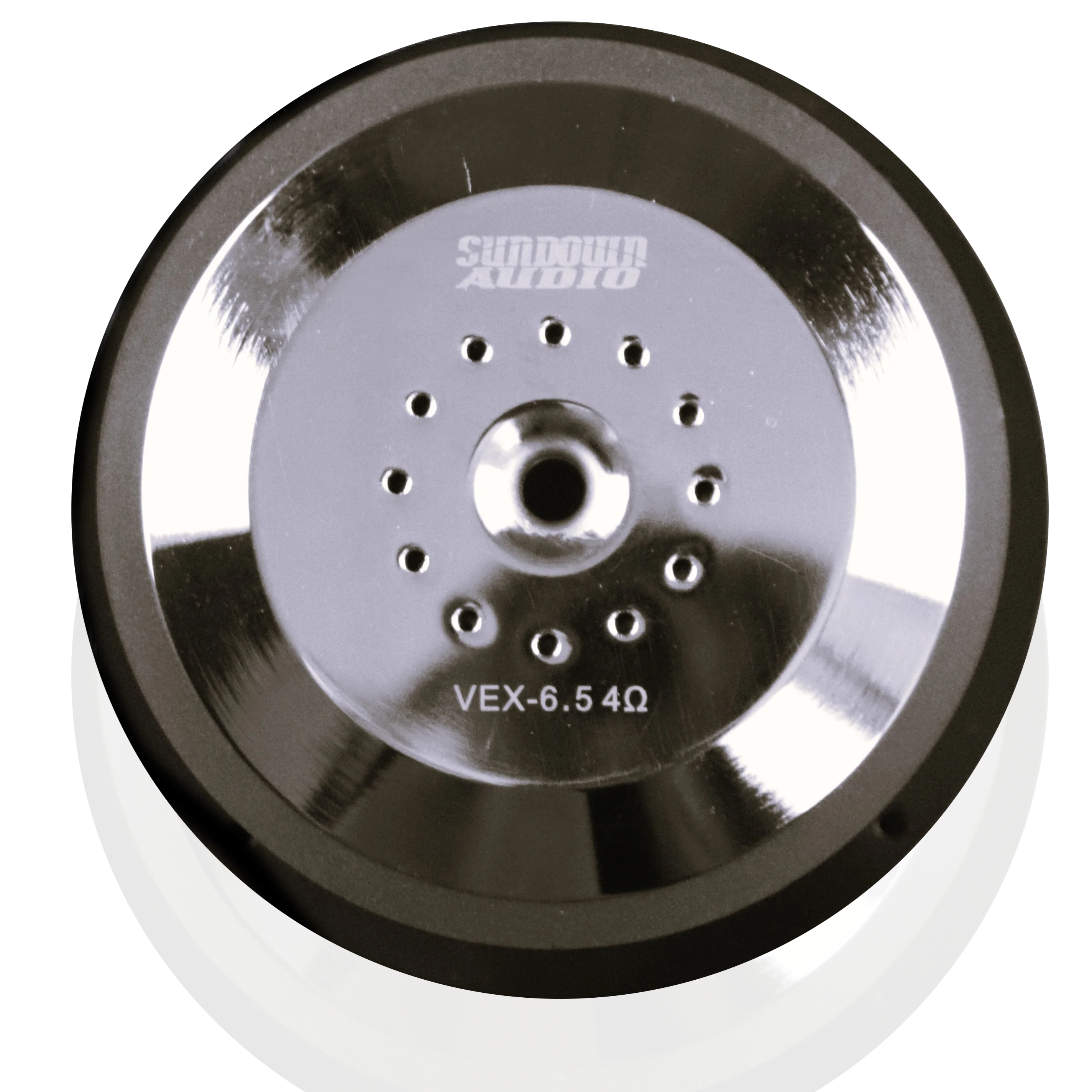 Close-up of a metallic component labeled VEX-6.5 4Ω, part of the Sundown Audio VEX-6.5 200W 6.5" Pro Audio Midrange Speaker from Sundown Audio, featuring a high-efficiency midrange. The shiny surface with a central circular design and small holes reflects light, highlighting its carbon fiber cone. This image showcases part of larger audio equipment.