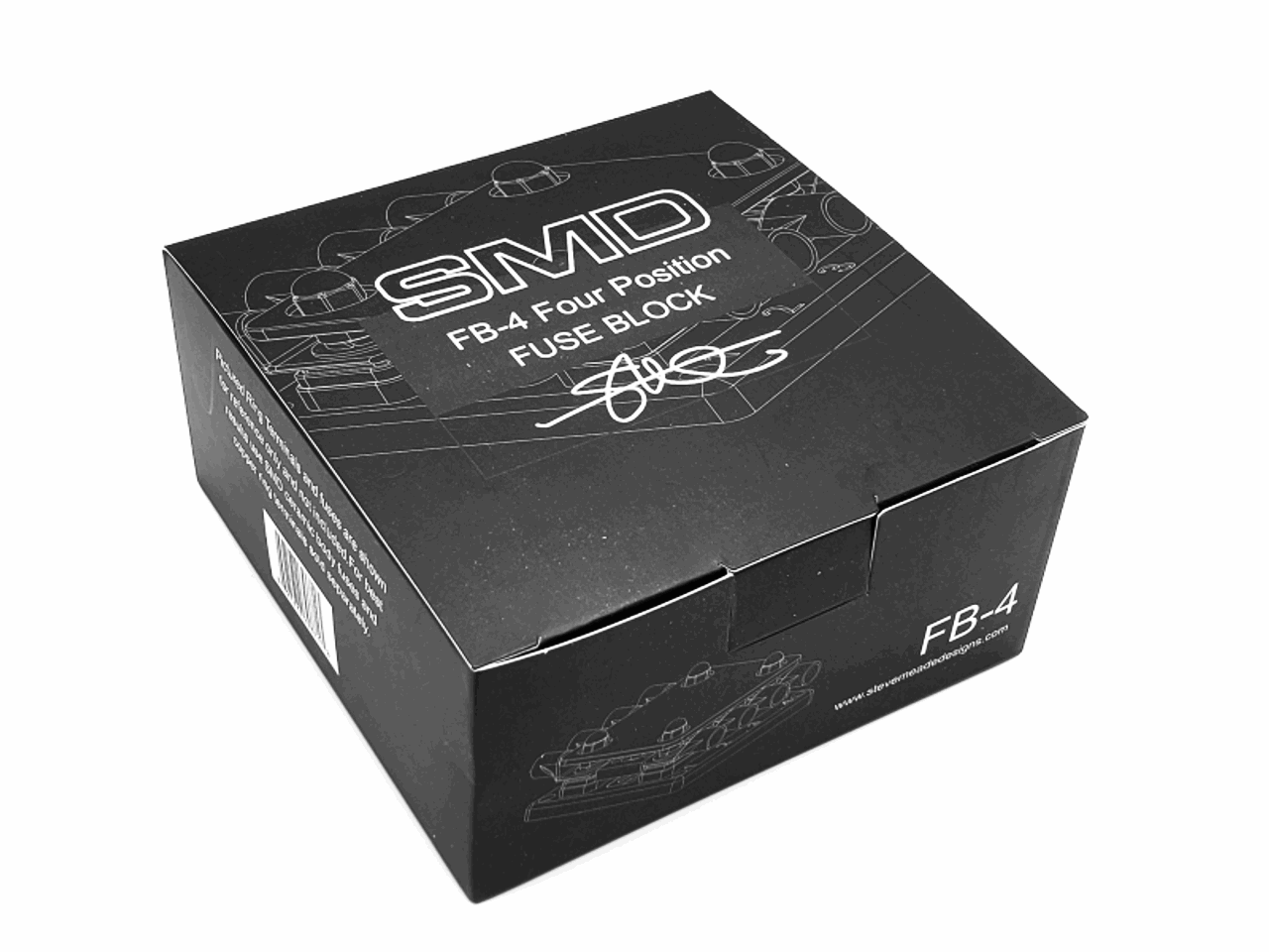 A black box with white text that says "SMD FB-4 Quad Fuse Block" by Steve Meade Designs. Ideal for vehicle protection, the packaging includes technical diagrams and a barcode on the side.