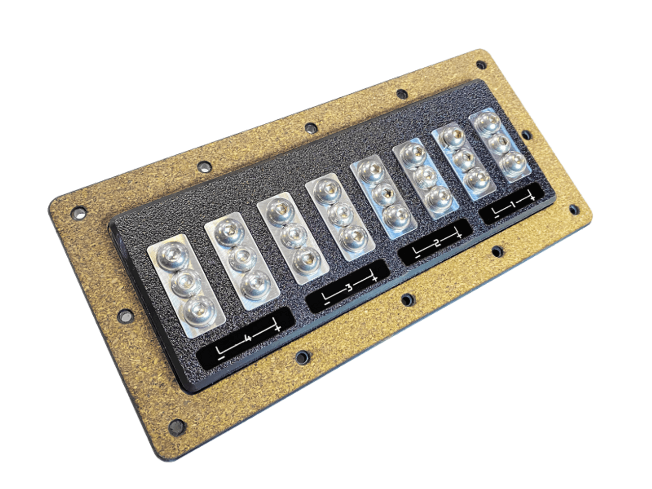 A rectangular panel, reminiscent of the SMD 4 Channel Speaker Terminal X-4 (TX-4) by Steve Meade Designs, showcases eight rows of silver circles arranged in pairs. Each row is clearly labeled with black and white text. This panel is affixed to a brown rectangular base featuring rounded corners and screw holes.